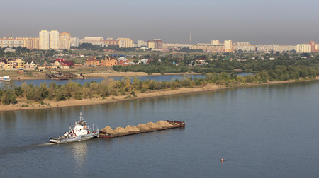 Barge with sand is on the Irtysh River. Omsk. Russia.の写真素材