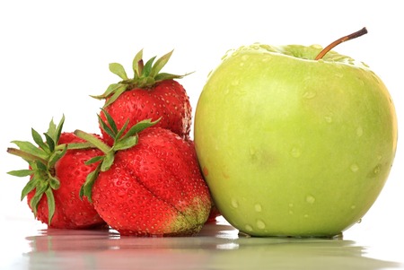 Strawberry and the green apple. Isolated background.の写真素材