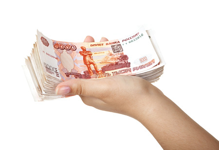 Stack of five thousandth bills in the female hand.