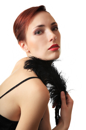 Beautiful girl with a feather. Isolated background.