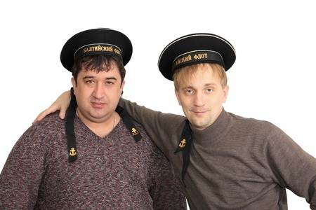 Men are in the service caps of seaman.の写真素材