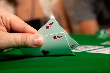 Pair of aces in his hand poker player.