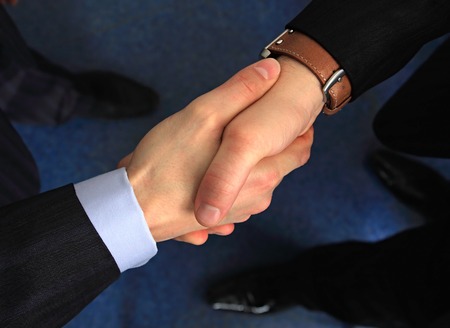 A business handshake is in an office.の写真素材