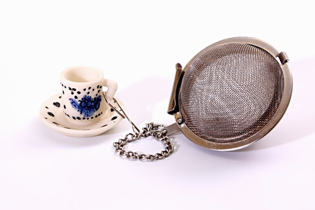 Tea-strainer for brewing of leaves expecting. Isolated background.の写真素材