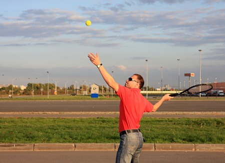 A man plays large tennis.の写真素材