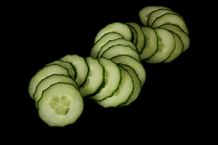 The Cucumbers. Vegetables on a black background.の写真素材