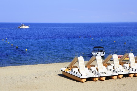 Sithonia, Greece - July 20, 2014: Catamaran on beach sand. Porto Carras Sithonia.のeditorial素材