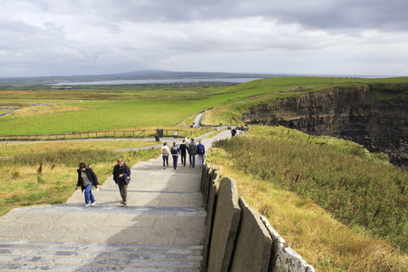 Clare, Ireland - August 25, 2014: Walking trail to the observation deck. Cliffs of Moher the most famous landmark in Ireland.のeditorial素材