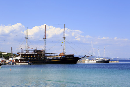 Ormos Panagias, Greece - July 11, 2014: Ships in the harbor of Ormos Panagias in Sithoniaのeditorial素材