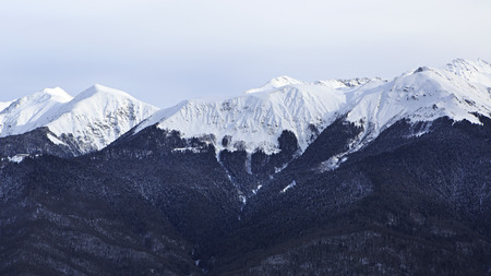 Beautiful snow-capped peaks of the Caucasus Mountains. Rosa Khutor Alpine Resort in Sochi. Russia.の写真素材