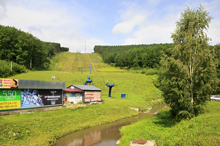 Belokurikha, Russia - August 06, 2013: Ski slopes and lifts in the summer. Mountain Tserkovka in Belokuriha.のeditorial素材