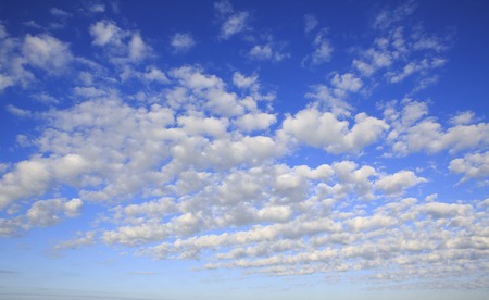 Beautiful cumulus cirrus clouds in the blue sky.