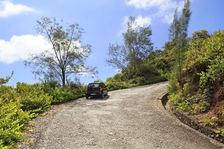 Praslin Island, Seychelles - March 10, 2015: Car in road on Mount Zimbvabve.のeditorial素材