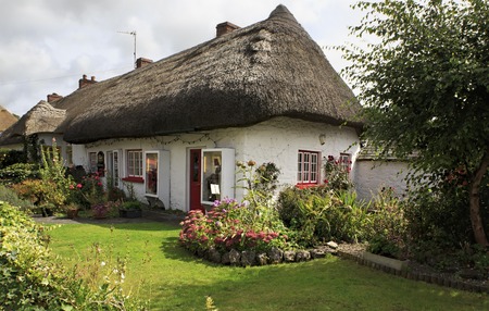 Adare, Ireland - August 25, 2014: Houses with thatched roof of the first half of the nineteenth centuryのeditorial素材