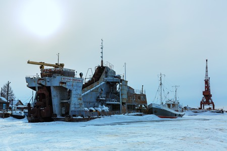 Ust-Barguzin, Russia - March 04, 2016: Pier on the shore of Lake Baikal in winter evening.のeditorial素材