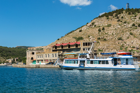 Sevastopol, Russia - June 09, 2016: Tourist ship in the Balaclava Bay. Former submarine base.のeditorial素材