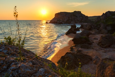 Sun rises over the Sea of Azov on Generals beach. Karalar regional landscape park in the Crimea.の写真素材