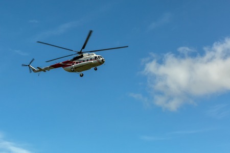 Kamchatka Peninsula, Russia - August 13, 2016: Tourist helicopter against the blue sky. South Kamchatka Nature Park. View from the helicopter.のeditorial素材