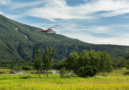 Kamchatka Peninsula, Russia - August 13, 2016: Tourist helicopter landed near the Khodutkinskiye hot springs. South Kamchatka Nature Park. View from the helicopter.のeditorial素材
