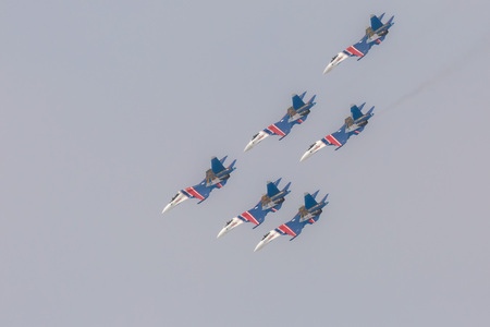 Omsk, Russia - March 19, 2016: Fighter Sukhoi Su-27 show aerobatics at an airshow Russian Knights.のeditorial素材