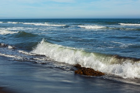 Khalaktyrsky beach with black sand. Pacific Ocean washes the Kamchatka Peninsula.