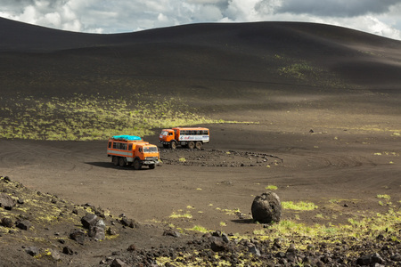 Kamchatka Peninsula, Russia - August 20, 2016: Kamaz trucks in the parking lot for tourists. North Breakthrough Great Tolbachik Fissure Eruption 1975のeditorial素材