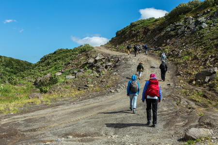 Kamchatka Peninsula, Russia - August 25, 2016: Group of tourists walks along the Viluchinsky passのeditorial素材