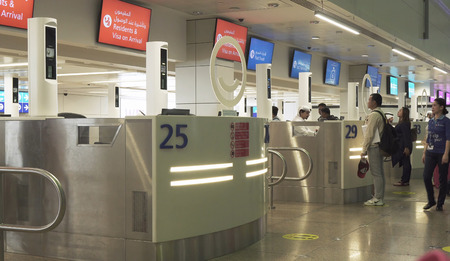 Dubai, UAE - March 30, 2018: Passengers in the zone of obtaining a visa at the Dubai International Airportのeditorial素材