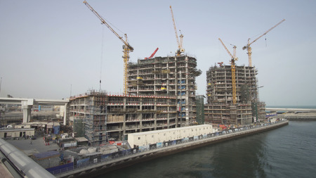 Dubai, UAE - April 01, 2018: Grandiose construction on the waterfront of Dubai Marinaのeditorial素材