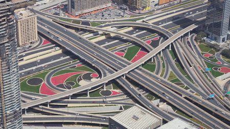 Dubai, UAE - April 09, 2018: Modern urban multi-level road junctions in Downtown Dubai view from the top stock footage videoのeditorial素材