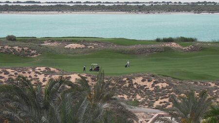 Abu Dhabi, UAE - April 03, 2018: Golf courses by the sea on Yas Island in Abu Dhabiのeditorial素材
