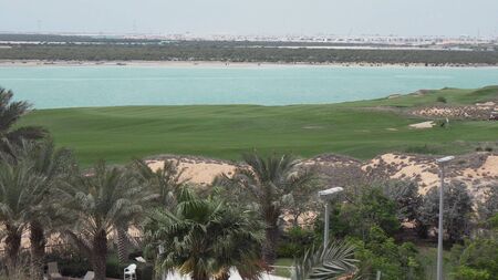 Abu Dhabi, UAE - April 03, 2018: Golf courses by the sea on Yas Island in Abu Dhabiのeditorial素材