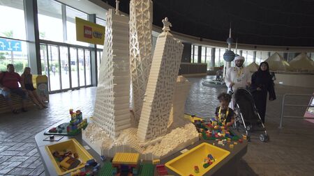 Dubai, UAE - April 01, 2018: Game table for children in exhibition from Lego pieces in Miniland Legoland at Dubai Parks and Resortsのeditorial素材