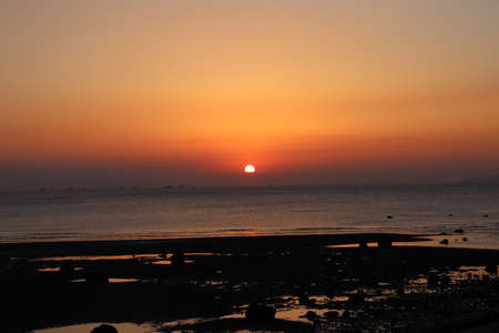 Sunset over the sea in the evening. Sunset over the sea.の写真素材