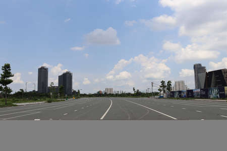 Highway in the city with blue sky and white clouds background.