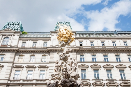 WIEN - MAY 17, 2013  People is walking in Graben St , old town main street  of Vienna, Austria  The column, called The Pestsule, was inaugurated in 1693 after the end of last big plague epidemics の写真素材
