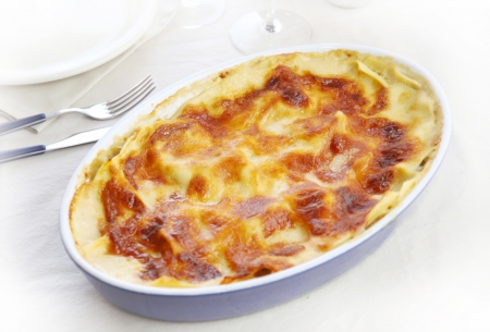 Baking dish of lasagne on the tableの写真素材