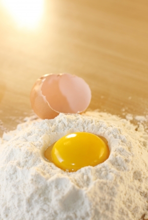 Eggs and flour on the tableの写真素材