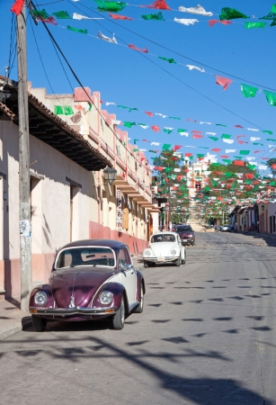 SAN CRISTOBAL DE LAS CASA, MEXICO - FEBRUARY 7, 2013  VW Beetle parked in a street in San Cristobal de las Casas, Mexico, on a sunny dayのeditorial素材