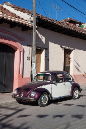 SAN CRISTOBAL DE LAS CASA, MEXICO - FEBRUARY 7, 2013  VW Beetle parked in a street in San Cristobal de las Casas, Mexico, on a sunny dayのeditorial素材