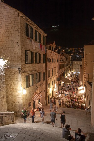 DUBROVNIK, CROATIA - JULY 20, 2013  Tourists walking down at night on Stradun, the main street in the old town of Dubrovnik, running west from Pile Gate to Ploce Gate and the harbor in the east  のeditorial素材