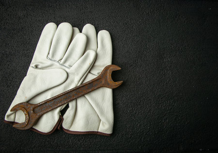 rusty retro key on the background of work gloves, metal, work gloves, rustyの写真素材