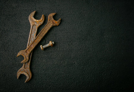 rusty retro tool, rusty metal on black background, vintage, designの写真素材