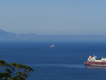 Overlooking the sea with tankerの写真素材