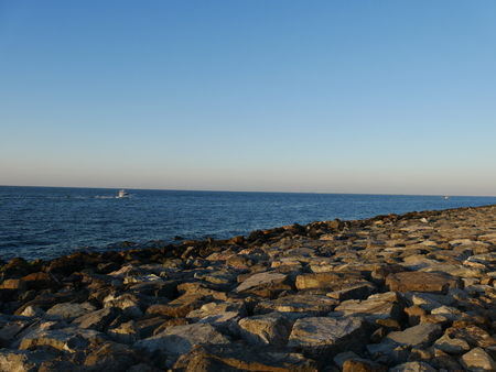 Stony coast with yachtの写真素材