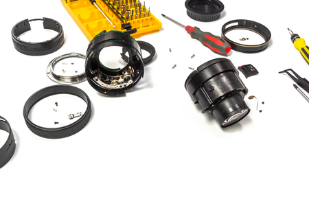 Camera lens repair view on white background with selective focus.の写真素材