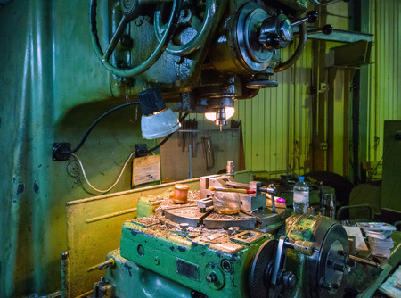 old big 5-axis milling machine with all manual controls and rotating tableの写真素材