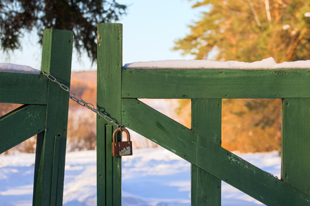 closed wooden gate at winter daylightの写真素材