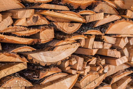 closeup background of firewood lumber leftovers stack with selective focus