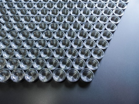 Shiny metal parts after cnc turning, on flat surface top-down flat lay background